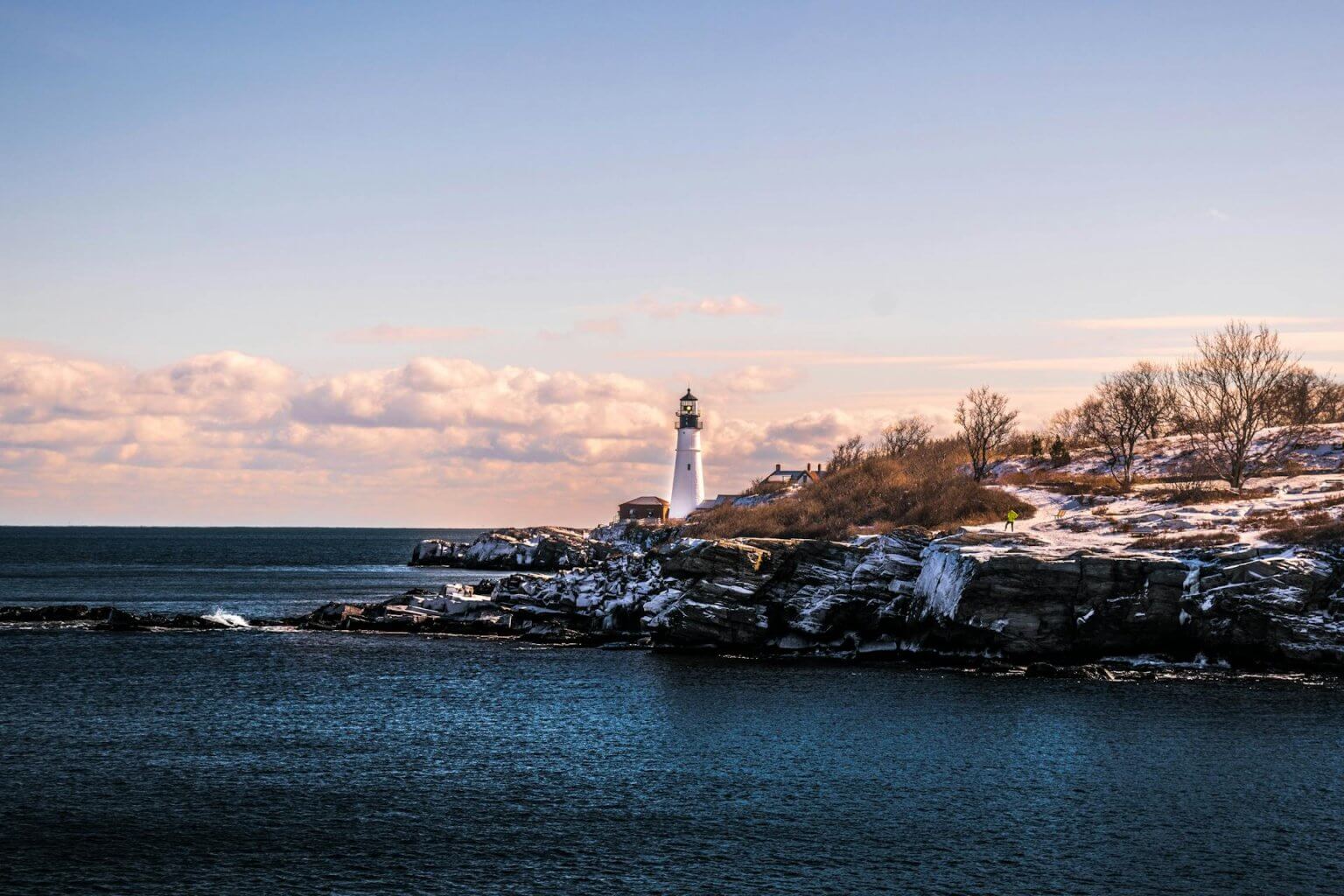 lighthouse in maine with snowfall